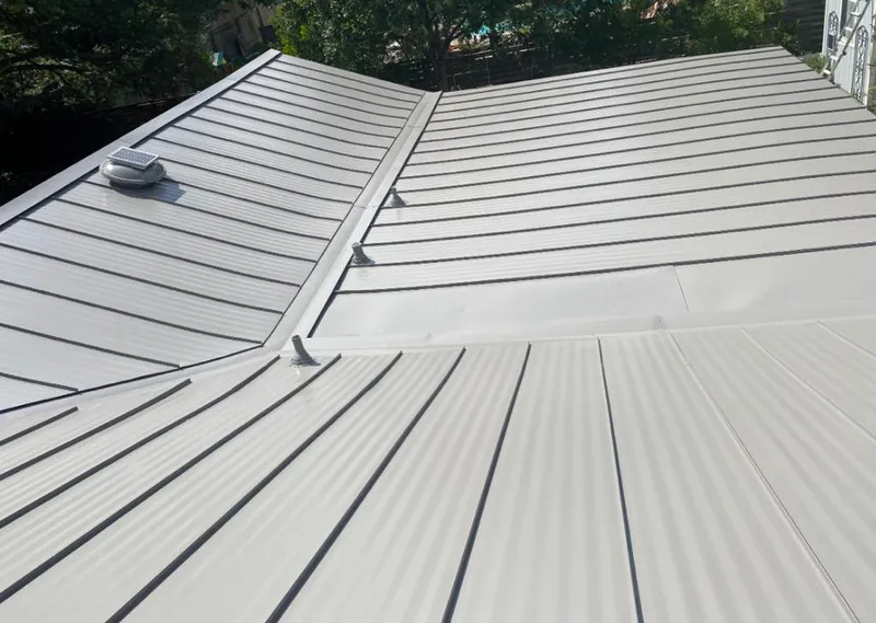 Solar attic fan installed on a metal roof for Roof Ventilation in North Platte